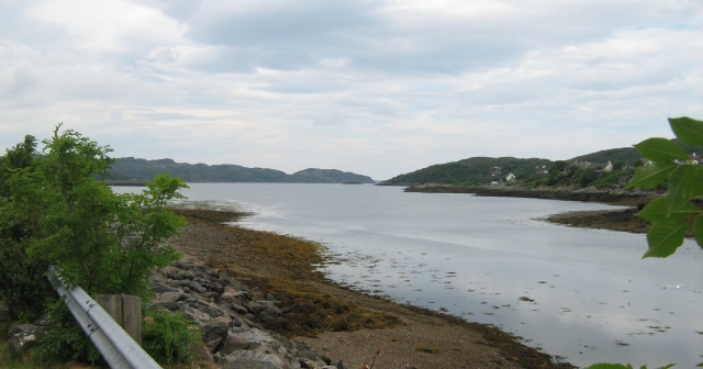 lochinver seen from lochinver village.  A broad stretch of water with hills all around